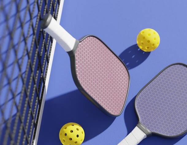 Never heard of pickleball? A paddle sport, it blends aspects of table tennis, tennis, and badminton. Played on a court the size of badminton, it uses a slightly altered tennis net. Player hit a perforated plastic ball over the net with solid-faced paddles. There are singles and doubles pickleball games.
